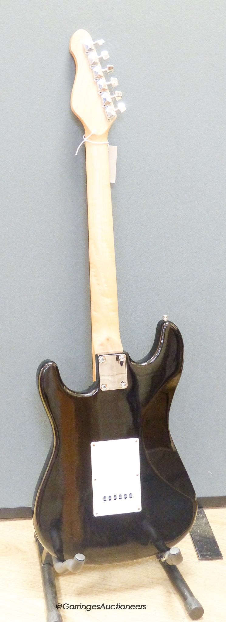 An Encore electric guitar with hard case